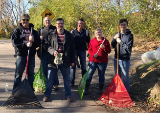 Photo of RBA employees raking leaves