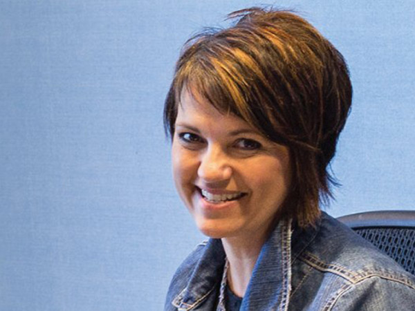 Image of RBA female caucasian employee smiling